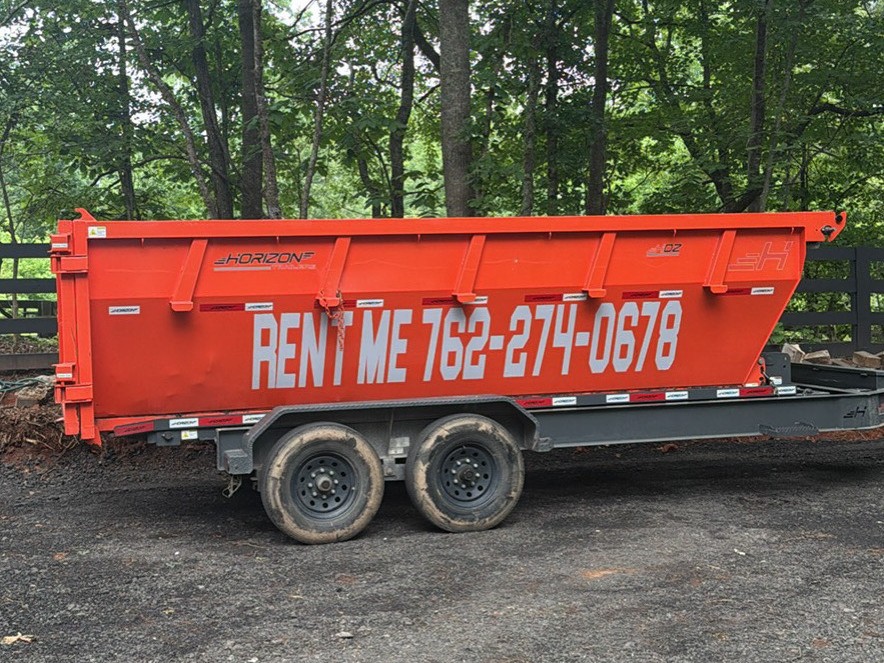 Red Clay red dumpster trailer close side view